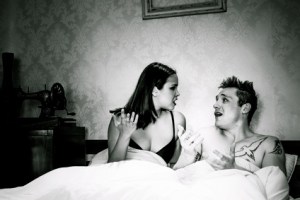Young couple arguing in bed